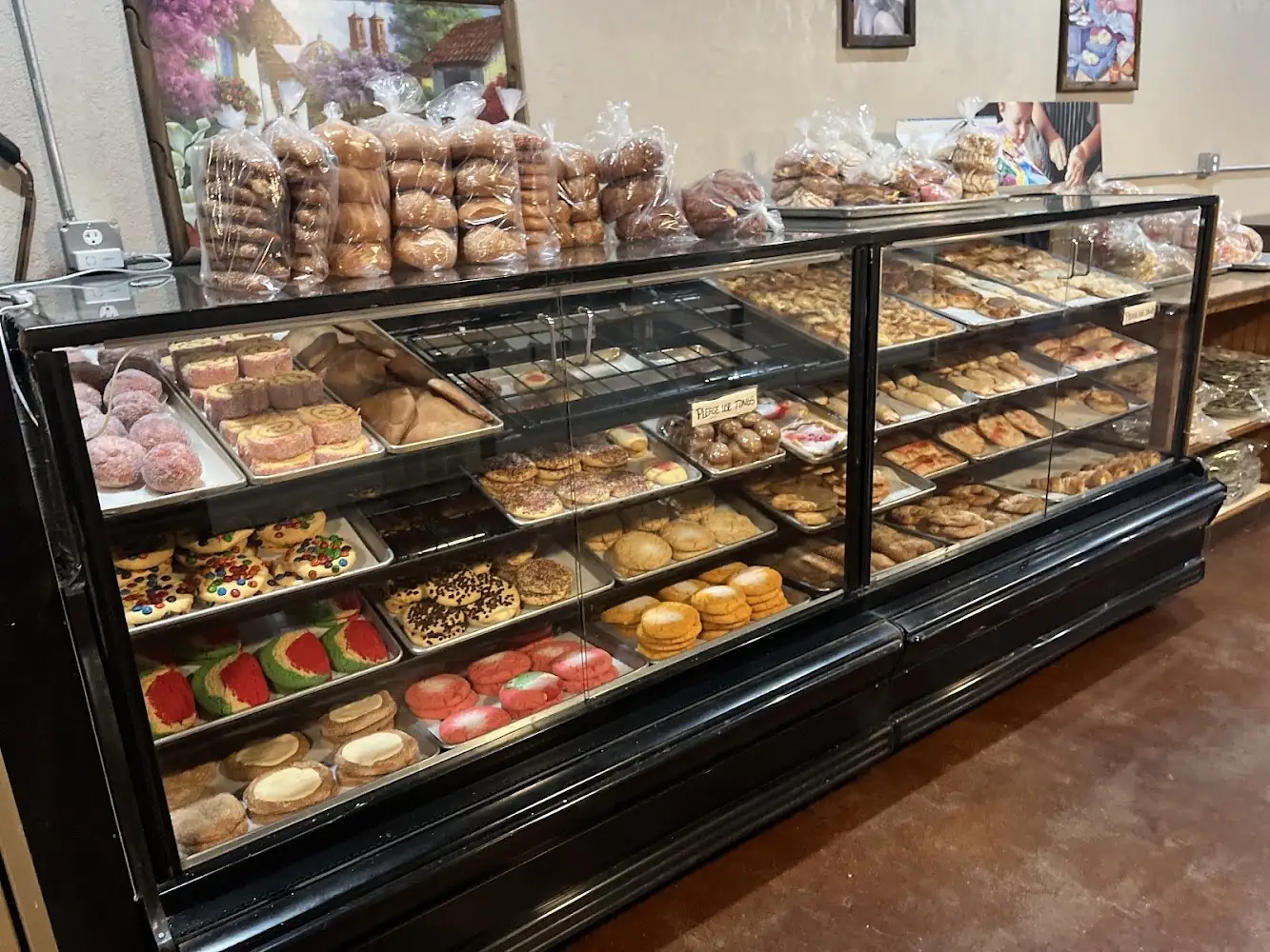 Glass cases full of pan dulce at La Luna at La Luna Bakery & Cafe