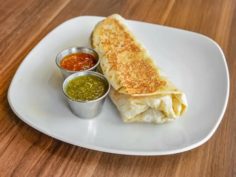 Burrito with red and green salsa
